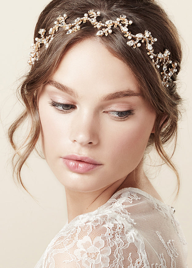 model wearing a lace top and a golden floral hairband