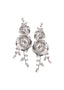Double silver floral and crystal statement earring on white background