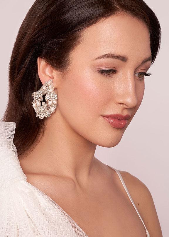 Floral embroidered bridal earring on model (side view)