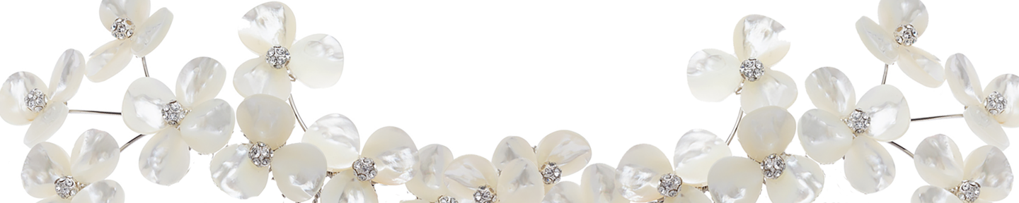 Decorative headband with white flowers and pearls on a white background