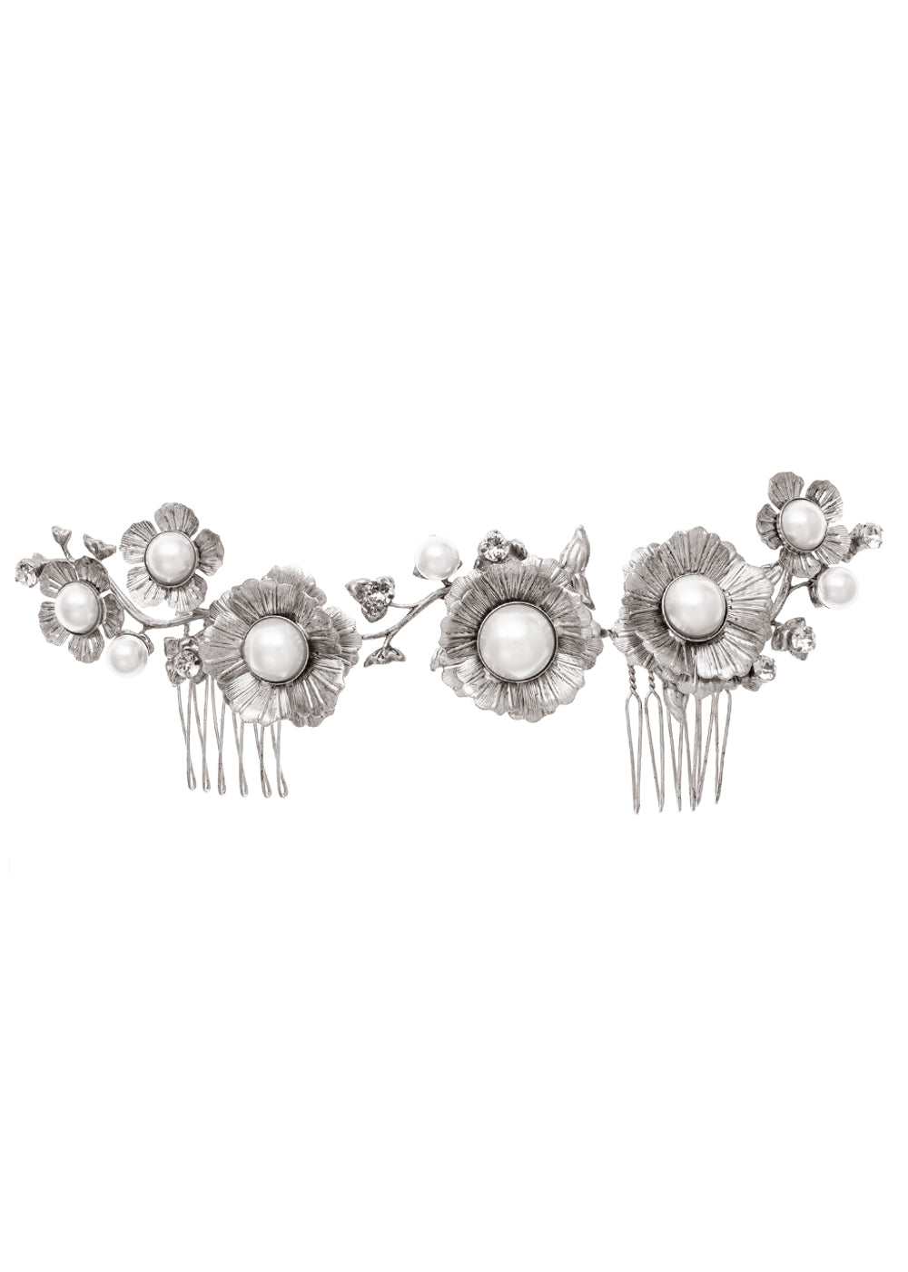 An antique silver plated floral haircomb with pearl accents on a white background