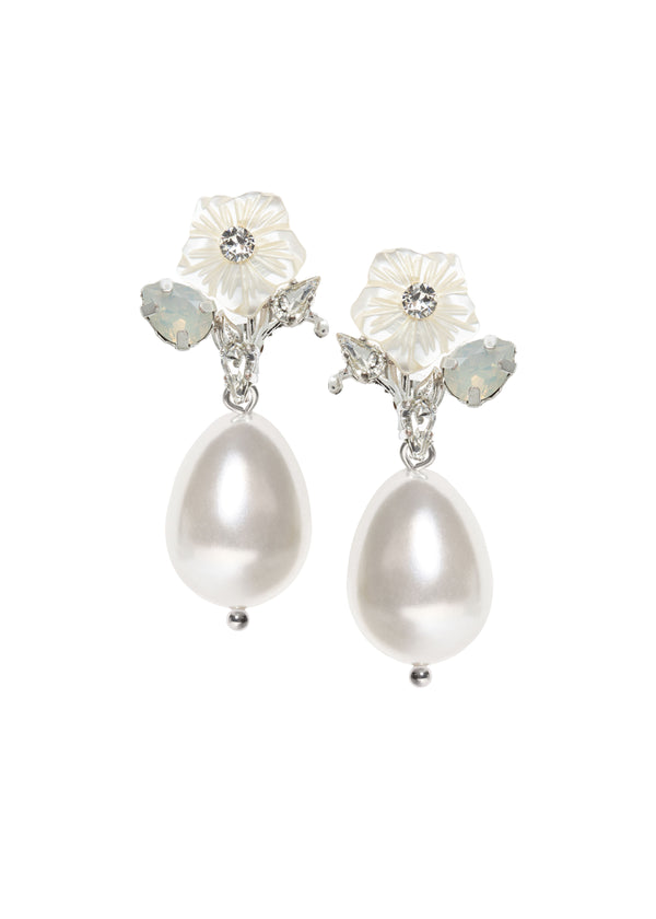A pair of pearl drop earrings with mother of pearl carvings and crystal embellishments on a rhodium-plated brass base.