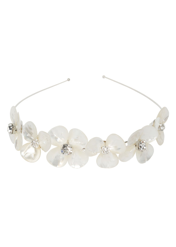 A silver floral mother of pearl headband on a white background