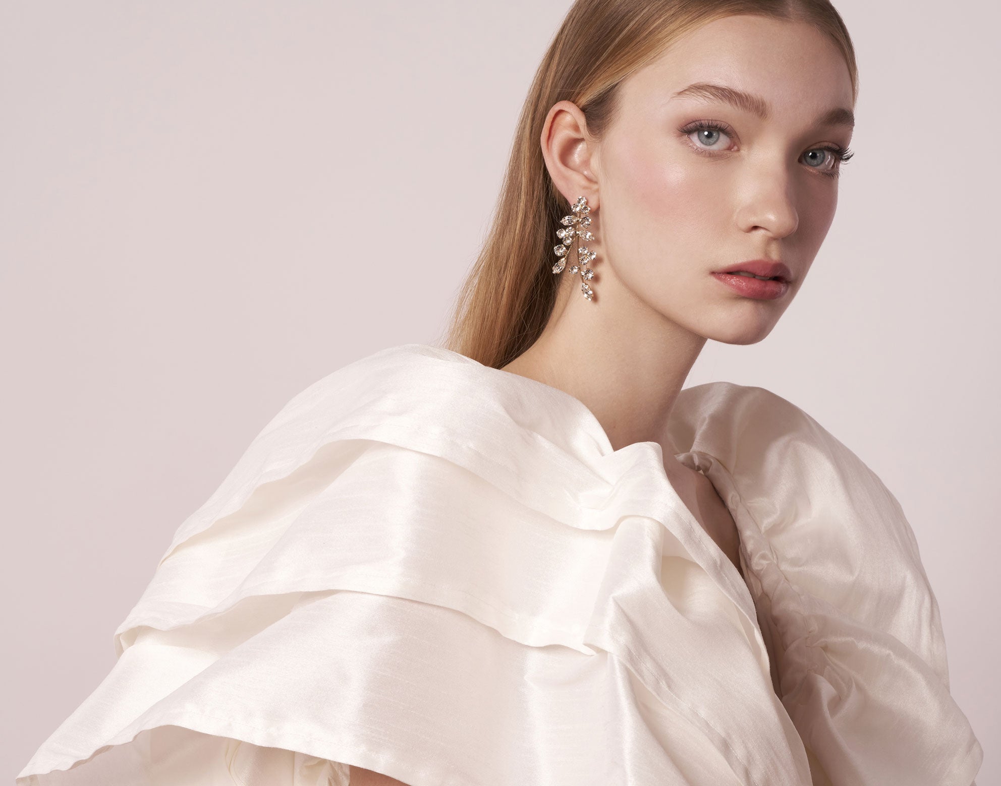 Crystal statement stud earring on model in wedding dress (side view)