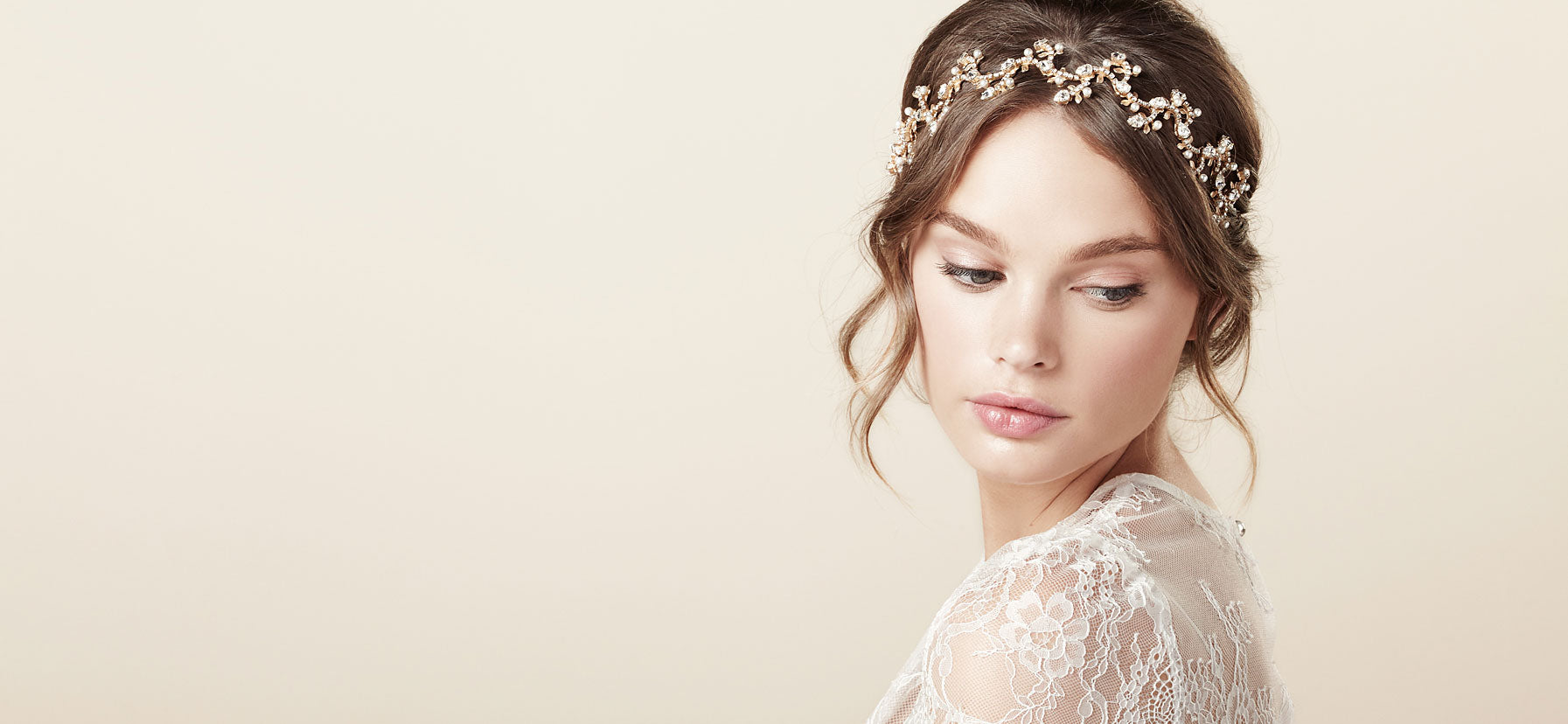 Gold floral wedding hairpiece on model in lace dress (side view)