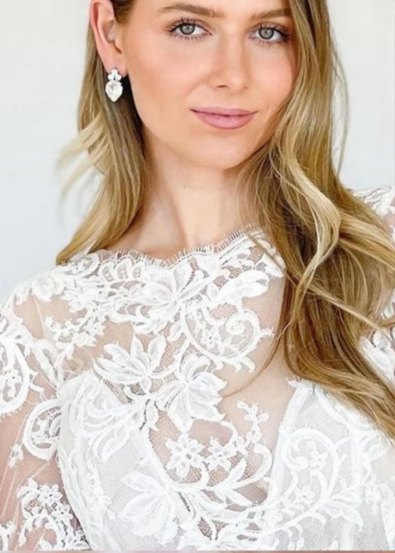 Crystal teardrop stud earring on bride in lace dress