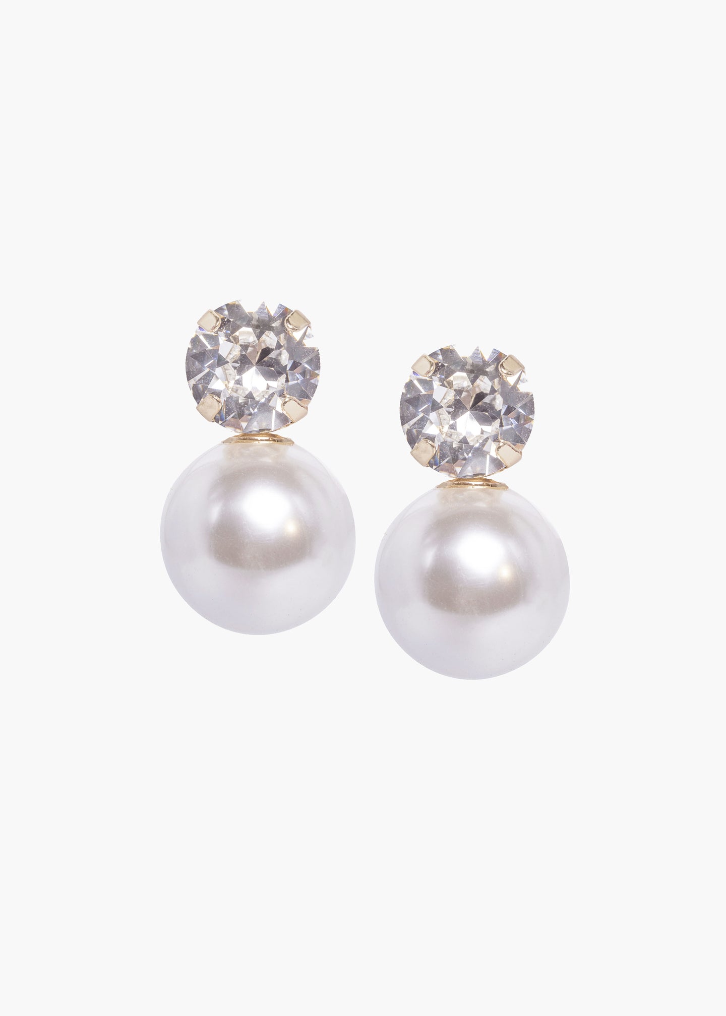 Pair of pearl earrings with crystal tops on a white background