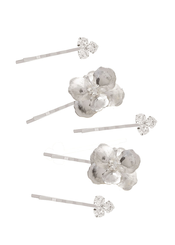a set of 5 silver floral hair pins set on white background