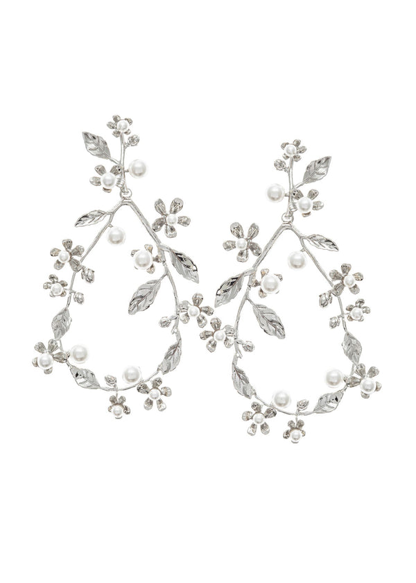 Silver pearl floral hoop earring on model side view