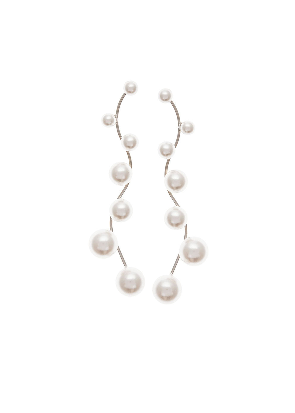 Long scattered pearl drop earring on white background