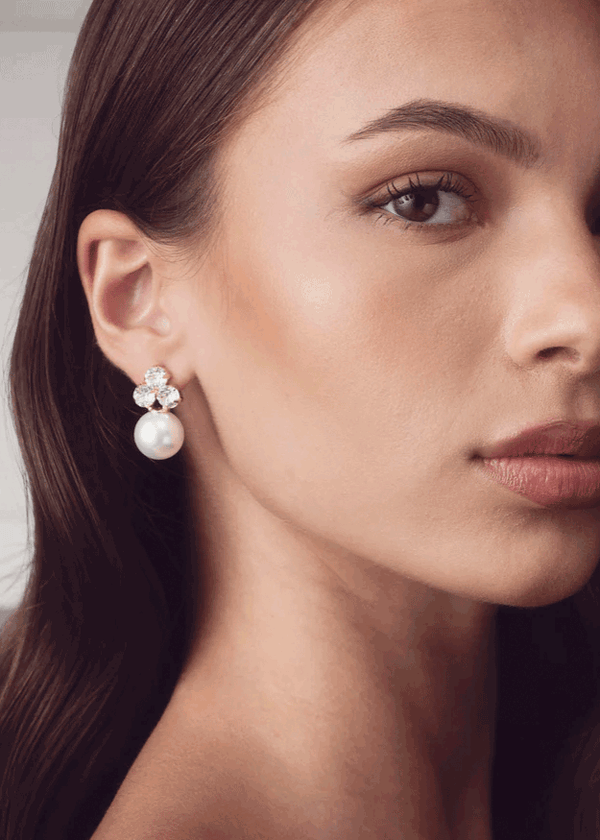 Pearl crystal stud earring on model