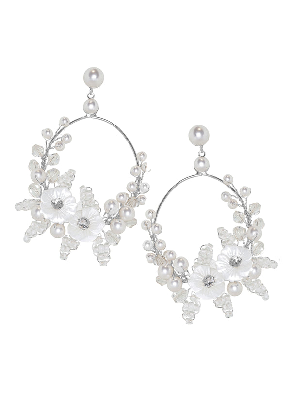 Silver floral hoop earring on white background
