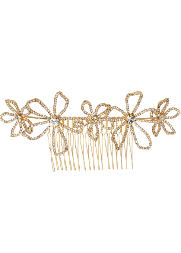 A gold crystal foral statement comb hairpiece on a white background