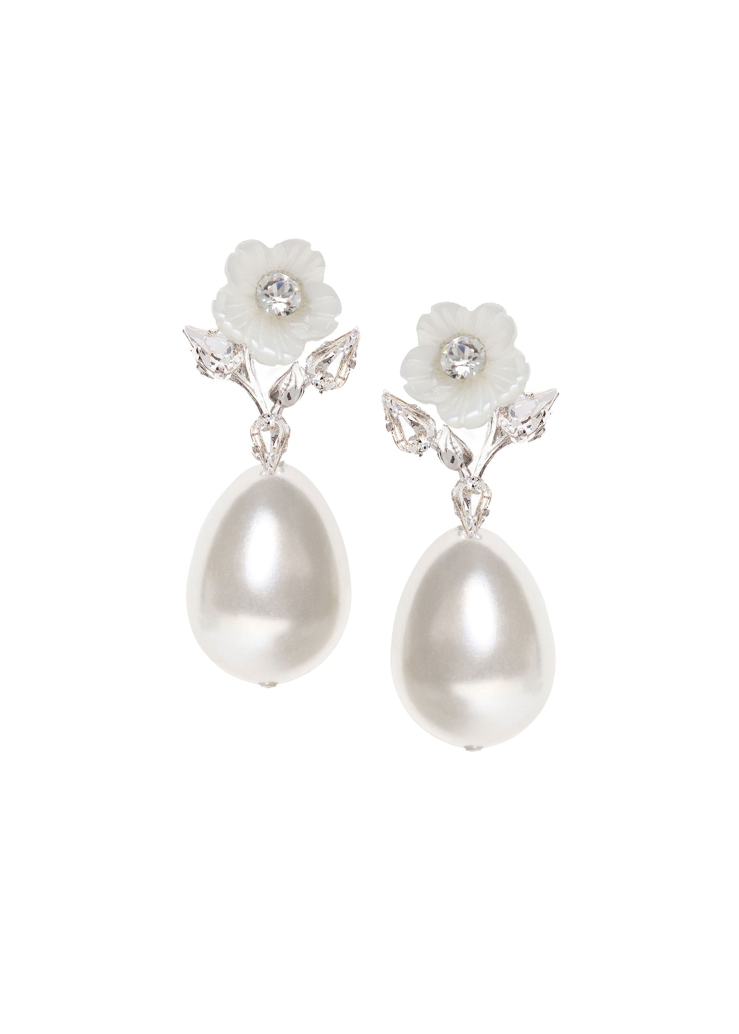 A pair of floral pearl earrings topped with a mother of pearl flowers and crystals on a white background