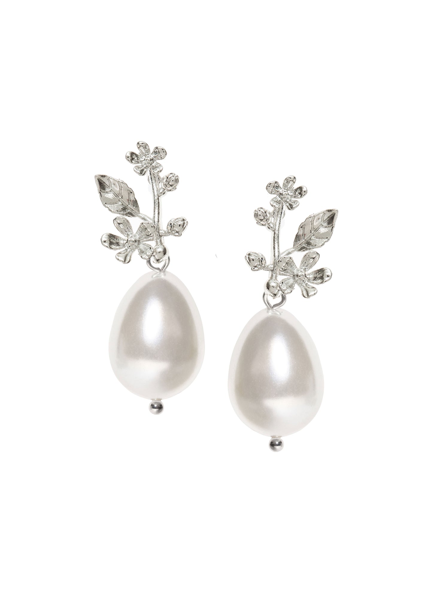 A pair of pearl earrings finished with a silver leaf top on a white background