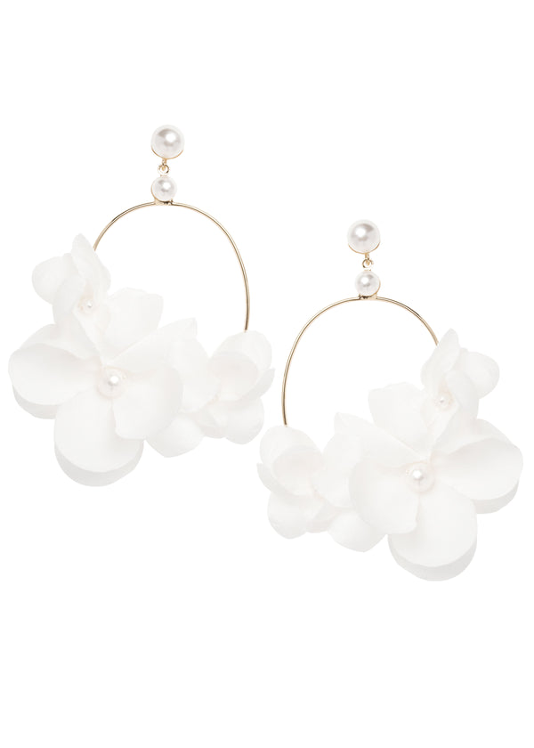 A dimensional hand sewn silk floral hoop earring with pearl accents no white background