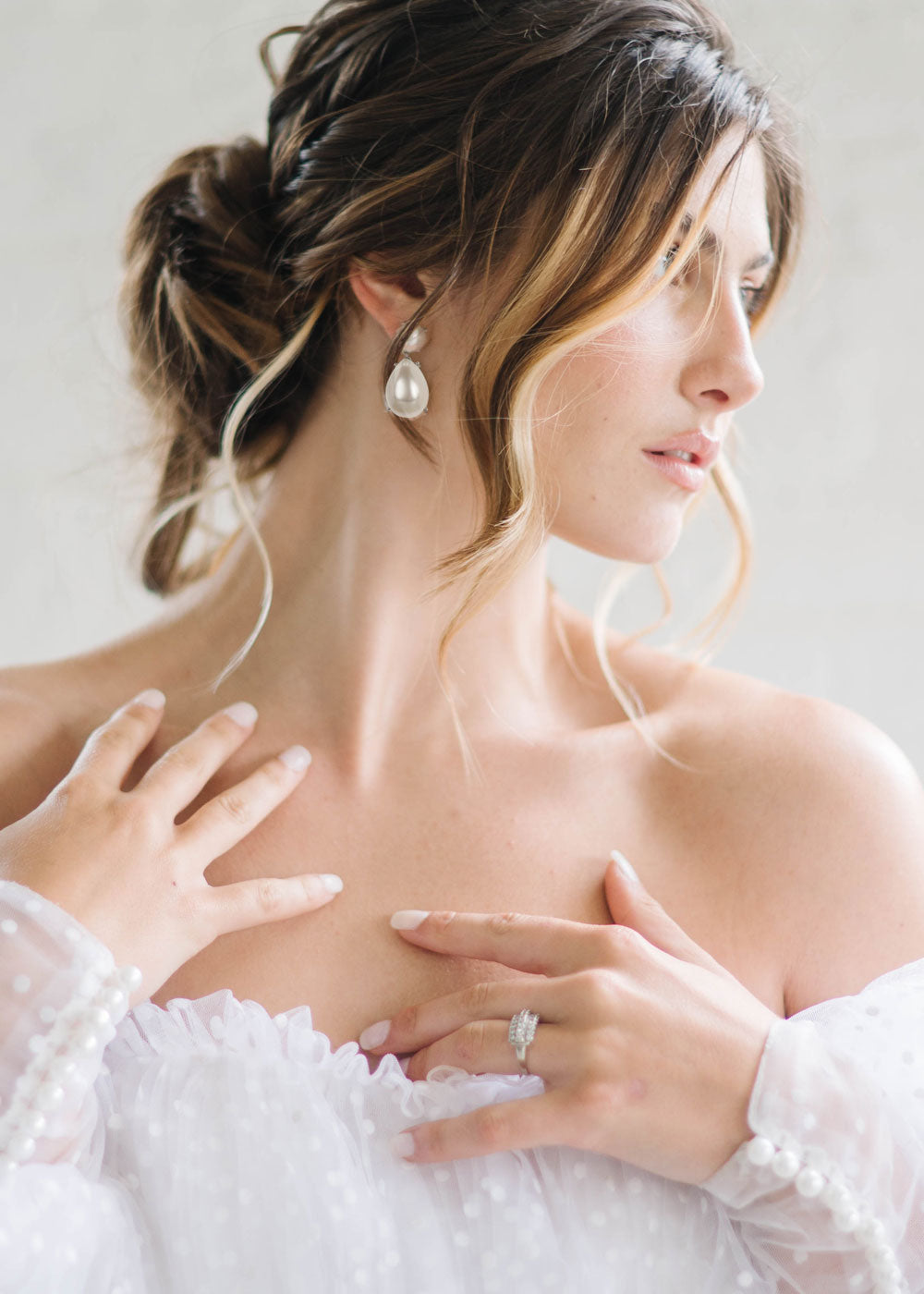 silver Pearl teardrop earring on model