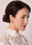Pearl and crystal mini bridal stud earring on model in lace dress