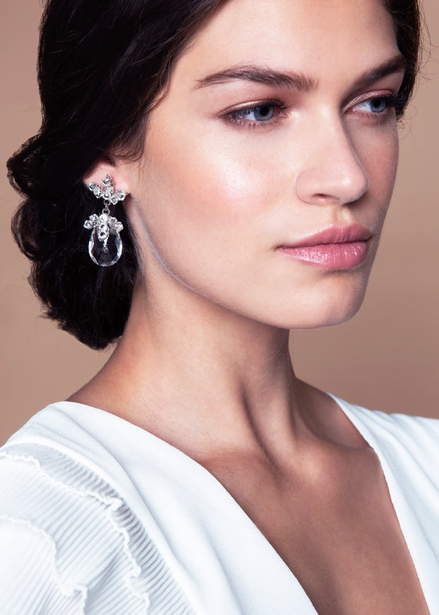 Crystal floral drop earring on models side view