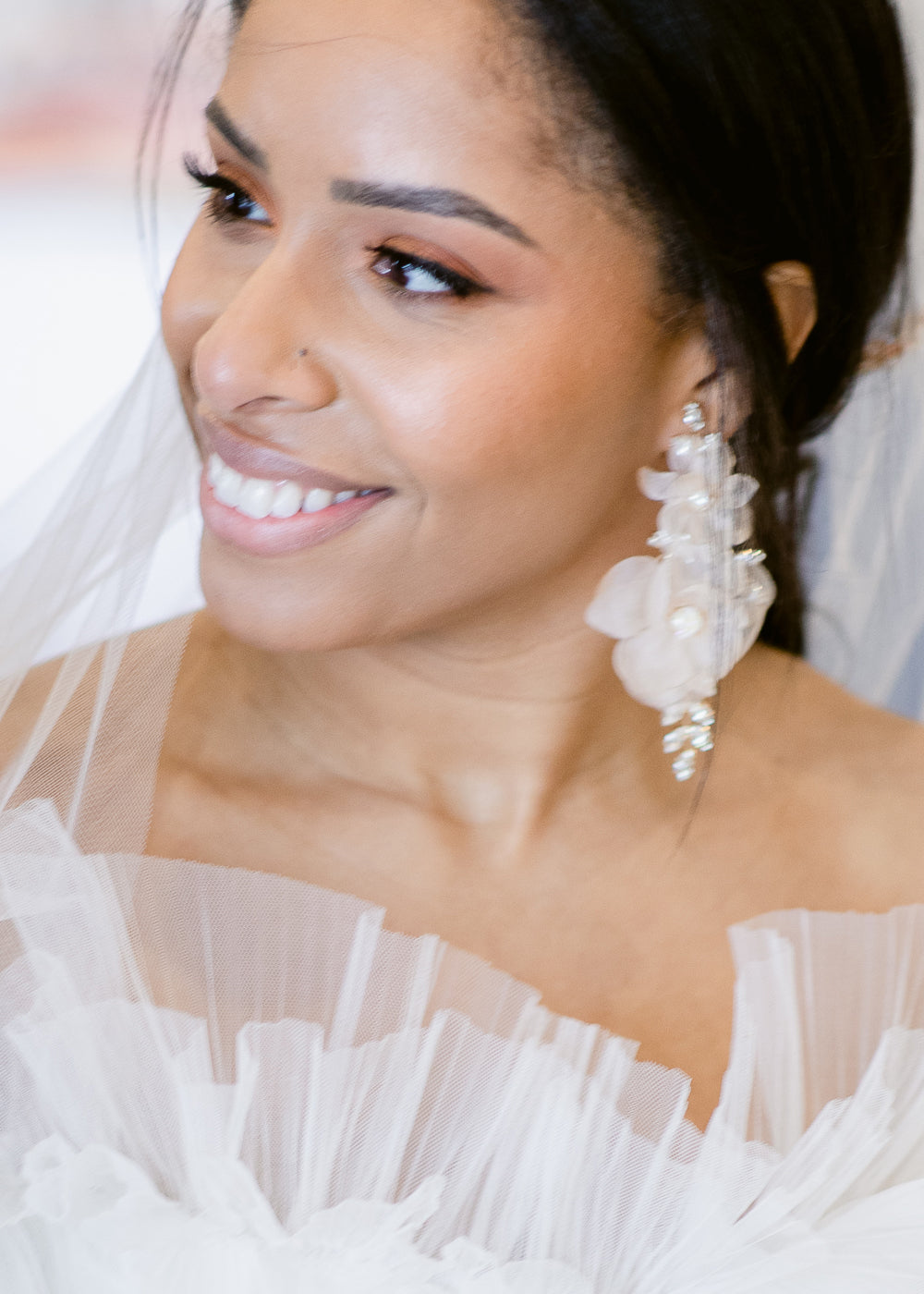 Floral Chandelier earring on model in tulle dress (side view)