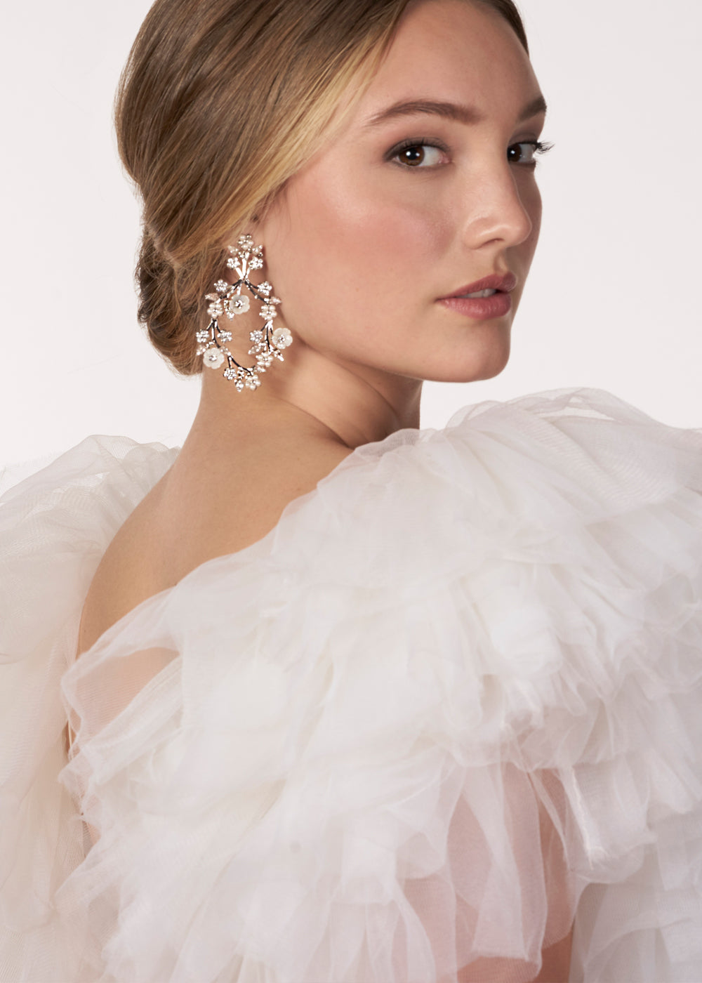 Floral Bridal hoop earring with mother of pearl flowers on model with tulle wedding dress