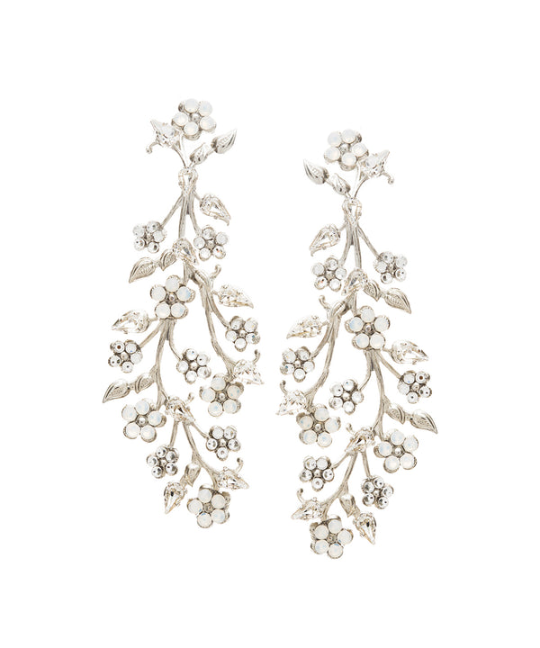 A pair of floral statement earrings on white background