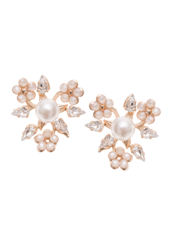 A pair of pearl stud earrings with brass base and claw set crystals.