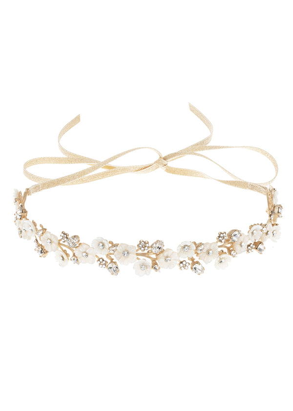 Golden floral wedding hairpiece  with mother of pearl flowers laid flat on white back ground