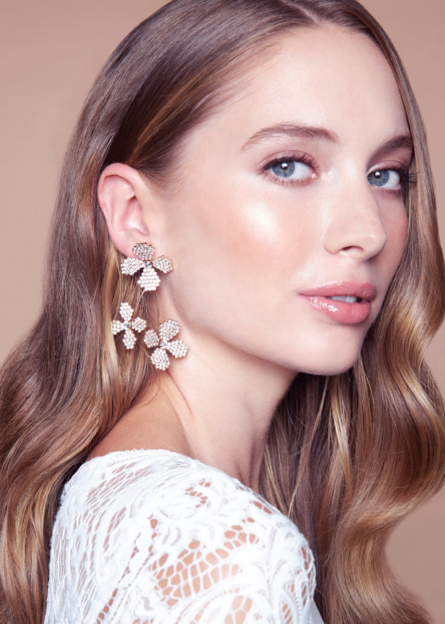 floral Swarovski crystal cascading earring in gold on white background
