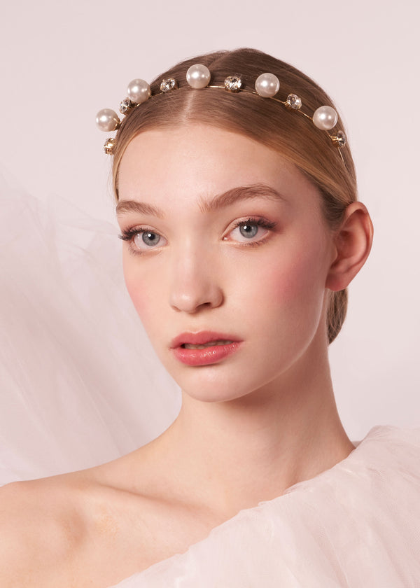 Scattered pearl and crystal headband on model in tulle dress (front view)