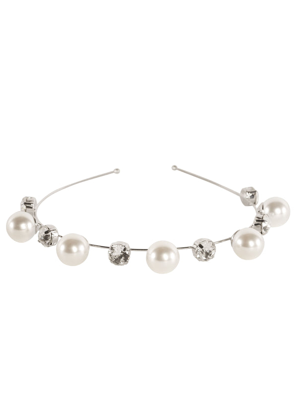 Scattered silver pearl and crystal bridal hairband on white background