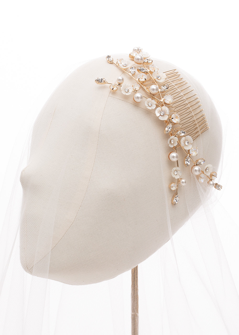 Mother of pearl gold bridal hair comb on head stand (side view)