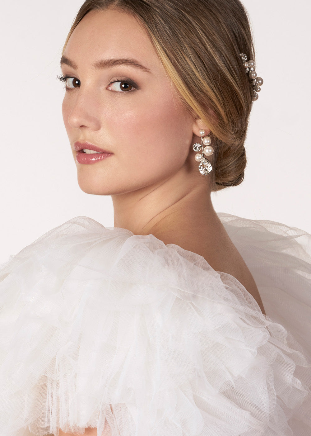 Pearl and crystal bubble style earring on model side view