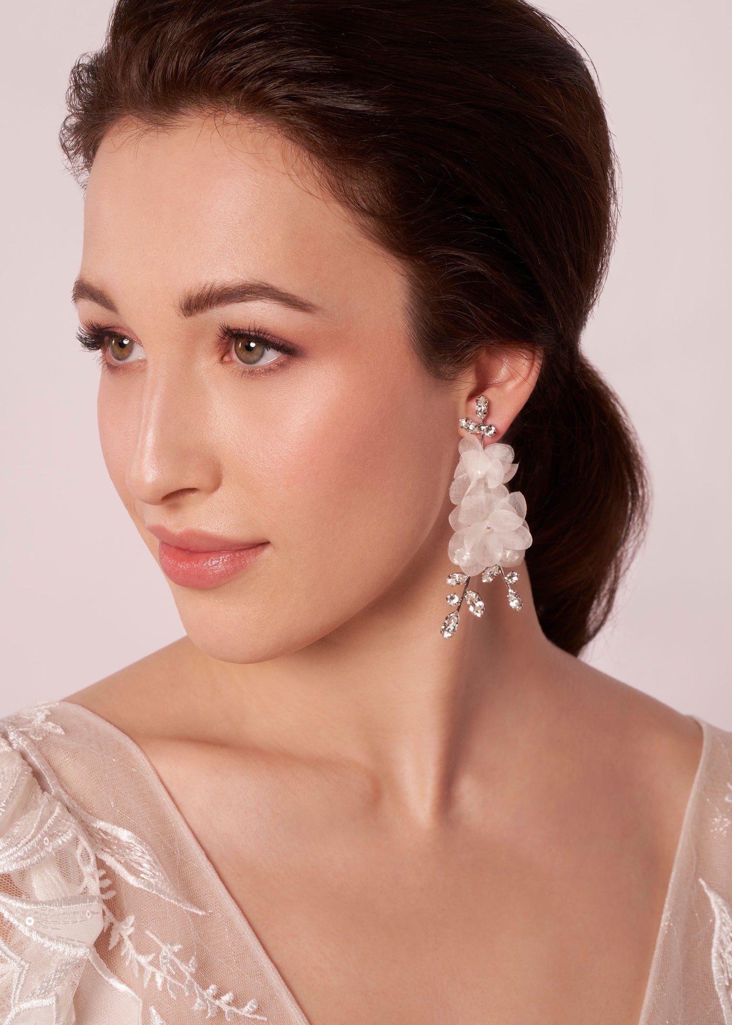 Silk floral and crystal chandelier earring on model (side profile)