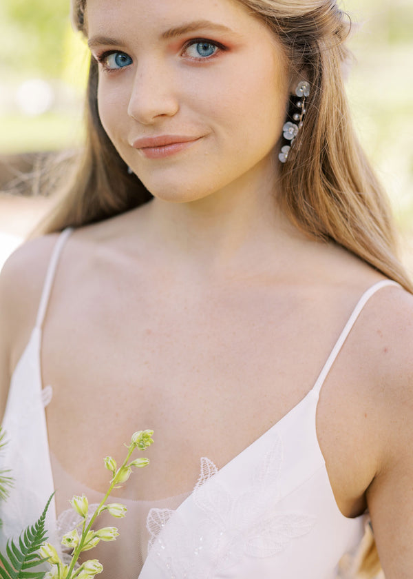 mother of pearl and crystal floral drop earring on on bride