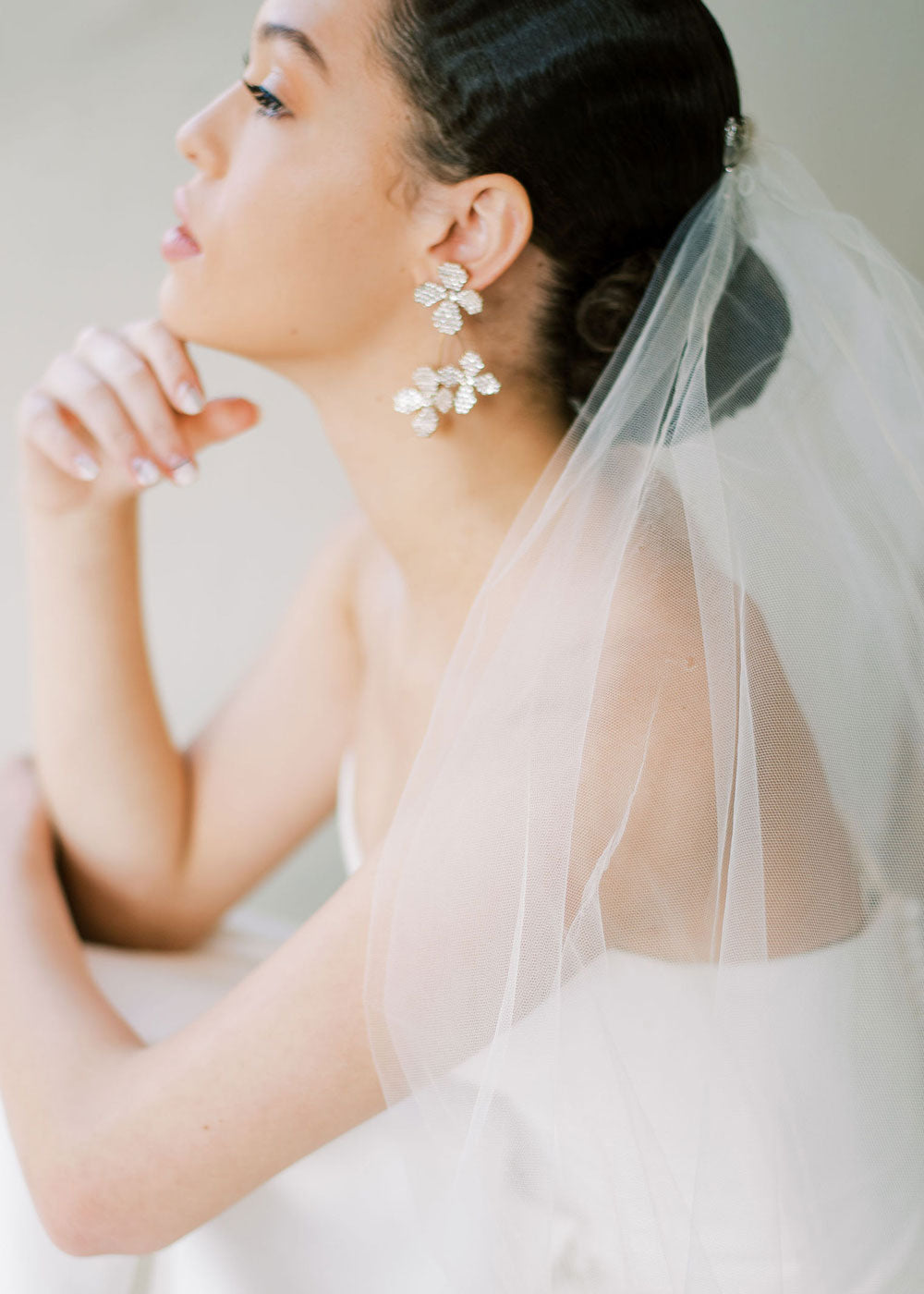floral Swarovski crystal cascading earring in silver on model side view