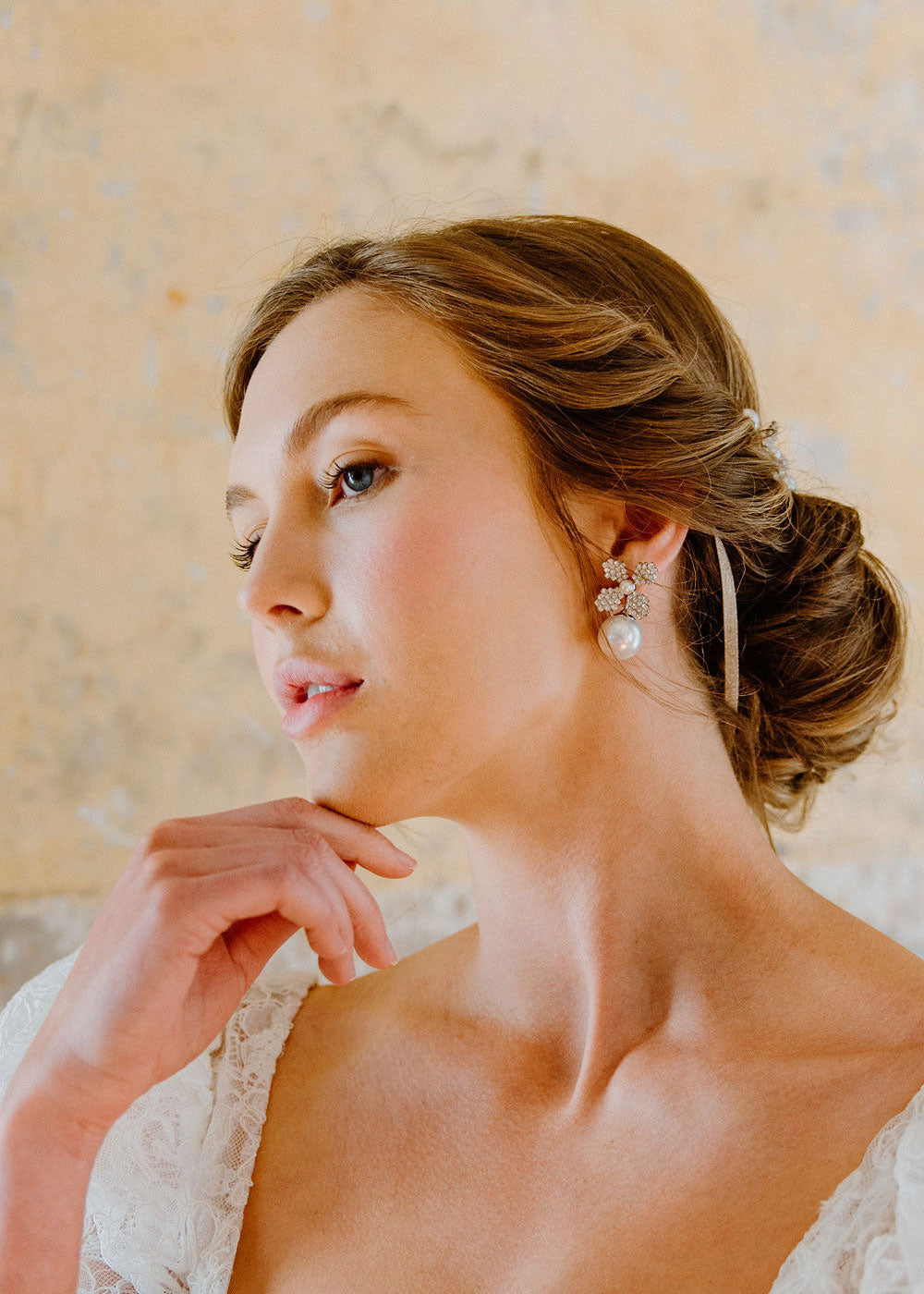 Swarovski crystal and pearl bridal stud earring on model side view