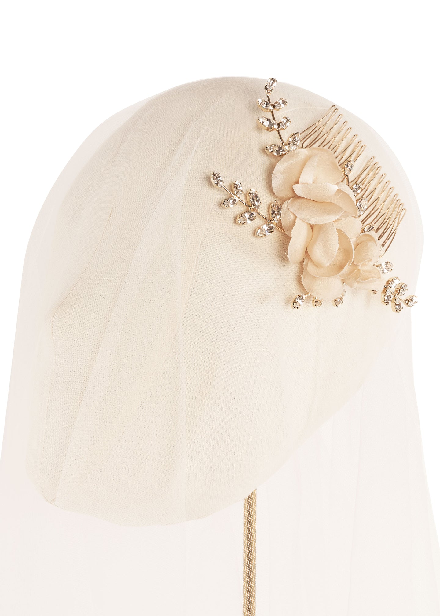 Gold floral hair comb on head stand with tulle (side view)