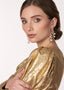 Cascading gold pearl chandelier earring on model large side view