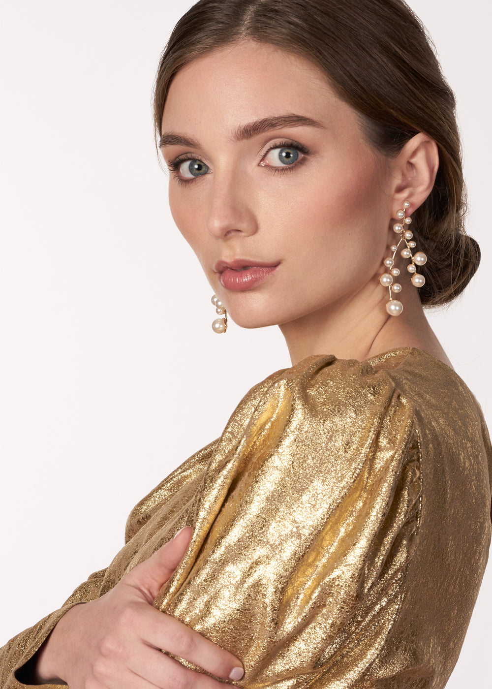 Cascading gold pearl chandelier earring on model large side view