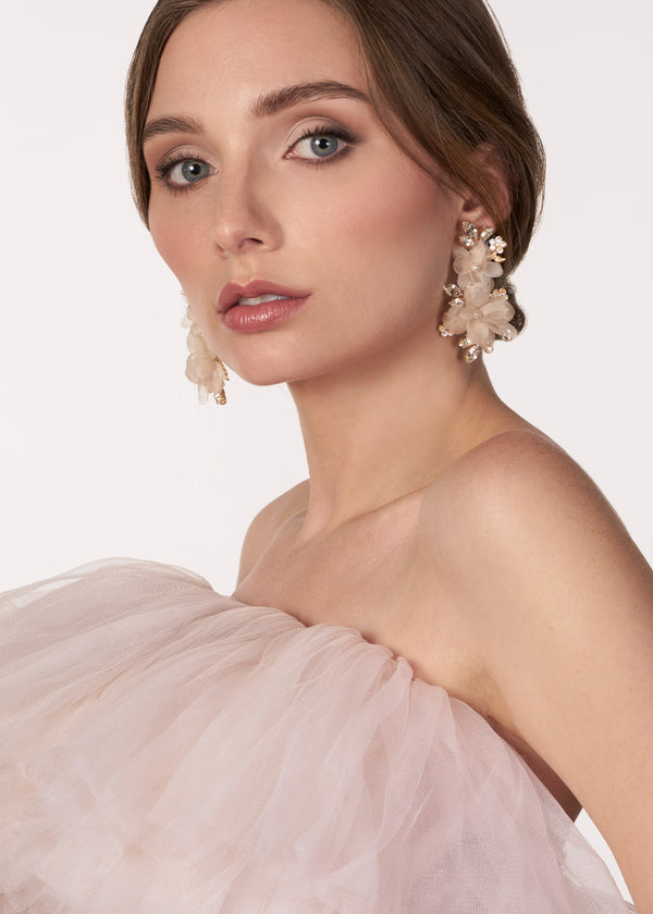 blush floral chandelier earring made with silk flower, crystals and pearls on model in tulle dress