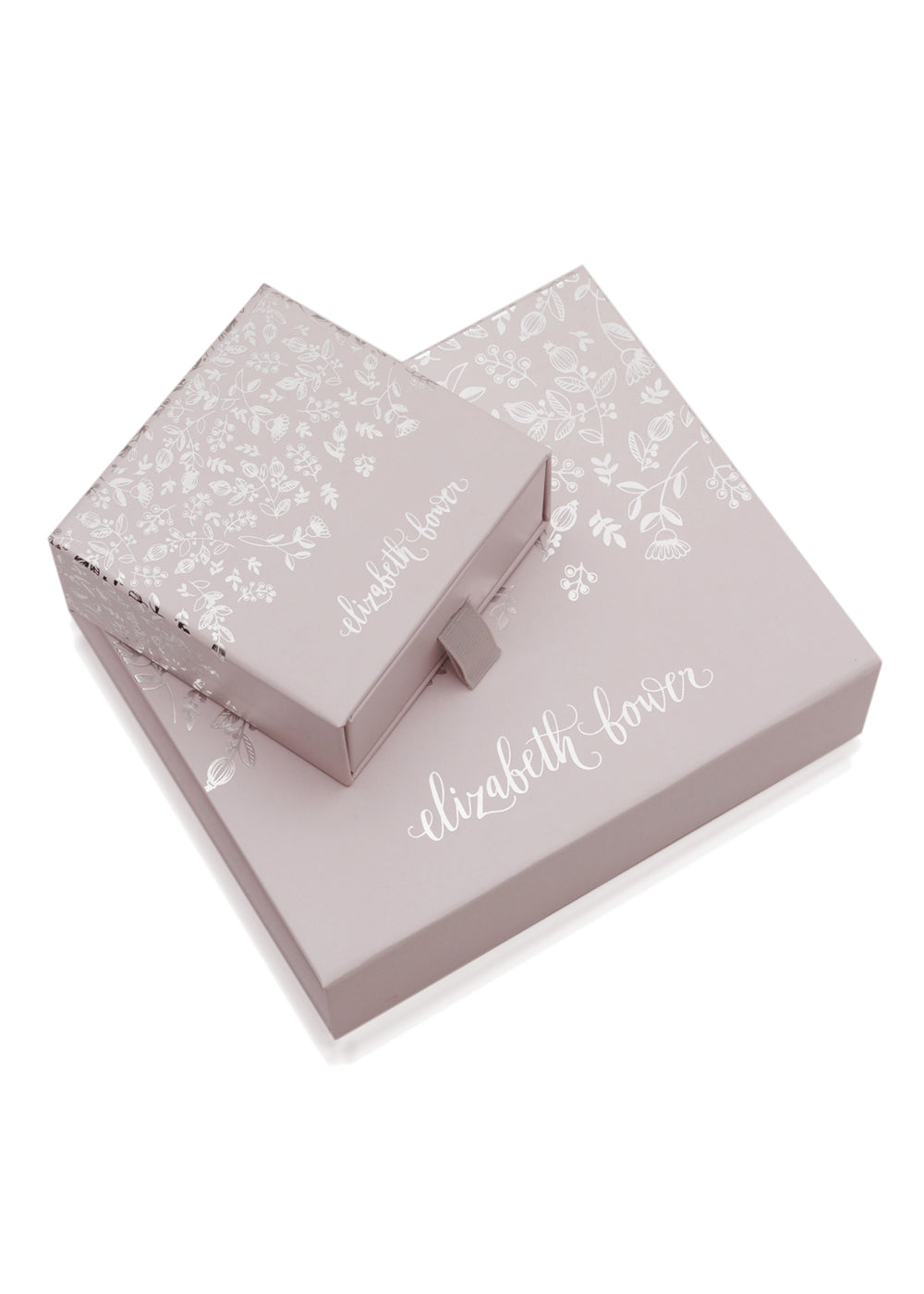 pink floral jewellery boxes stacked on top of each other on white background