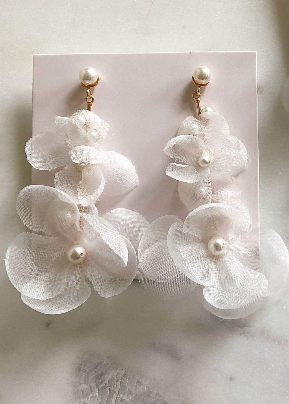 Silk floral drop earring in ivory and gold on pink ear card