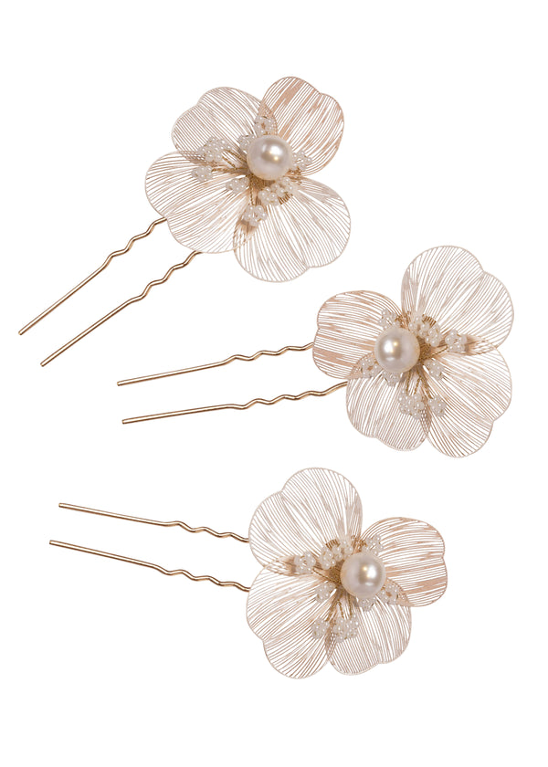 A set of 3 floral hair pins with pearl enters on a white background.