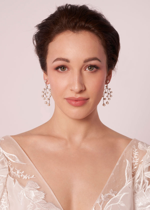 mini pearl cascade chandelier on model in wedding dress (front view)