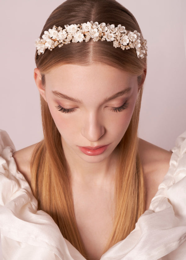 Bridal floral hairpiece on model front view