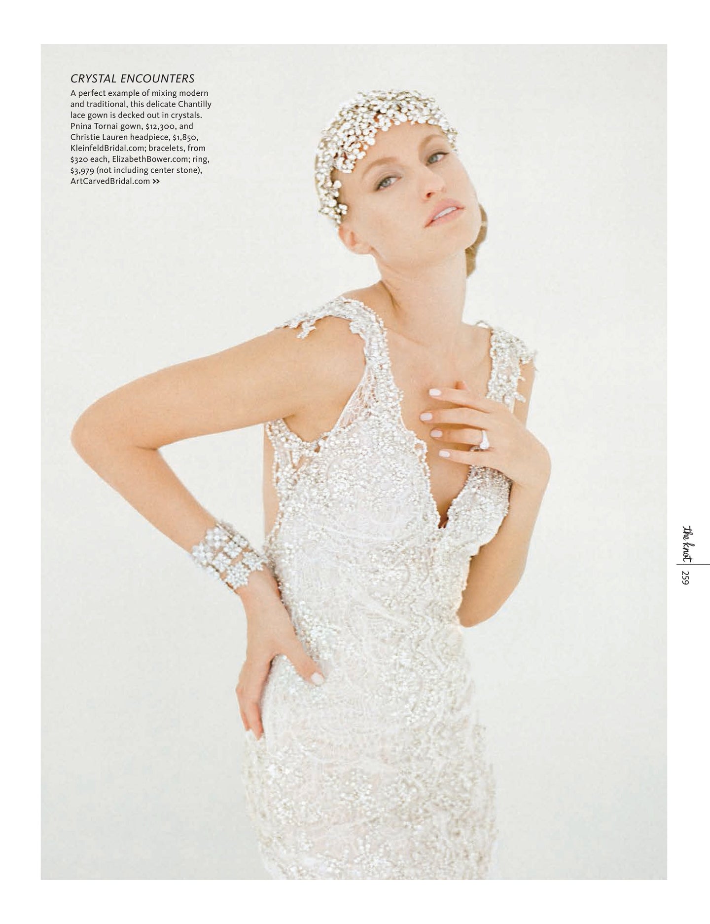 Model wearing a silver lace gown with a crystal hairpiece and crystal bracelets 
