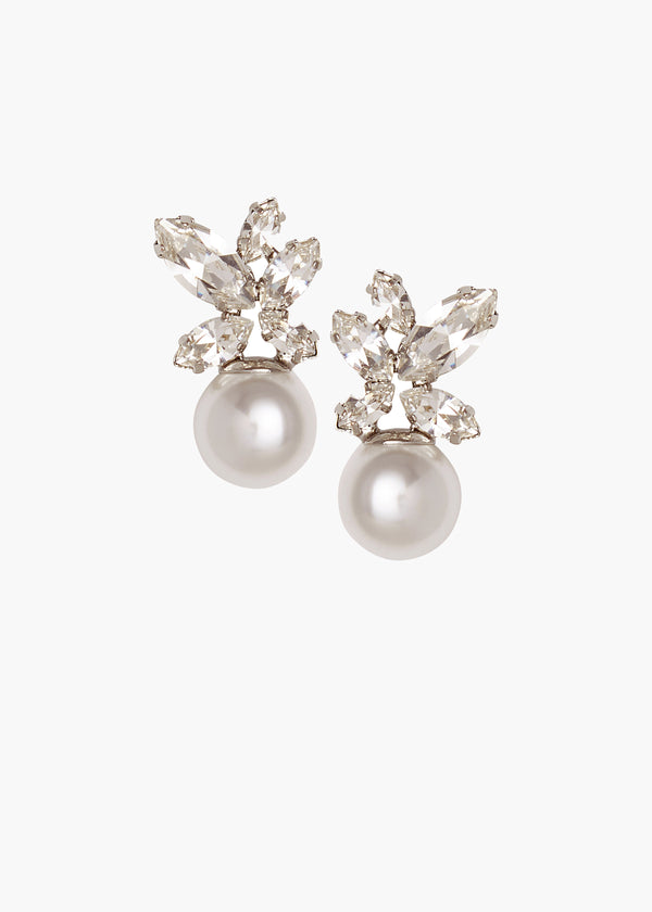 A pair of pearl stud earrings with Swarovski crystal top on a white background