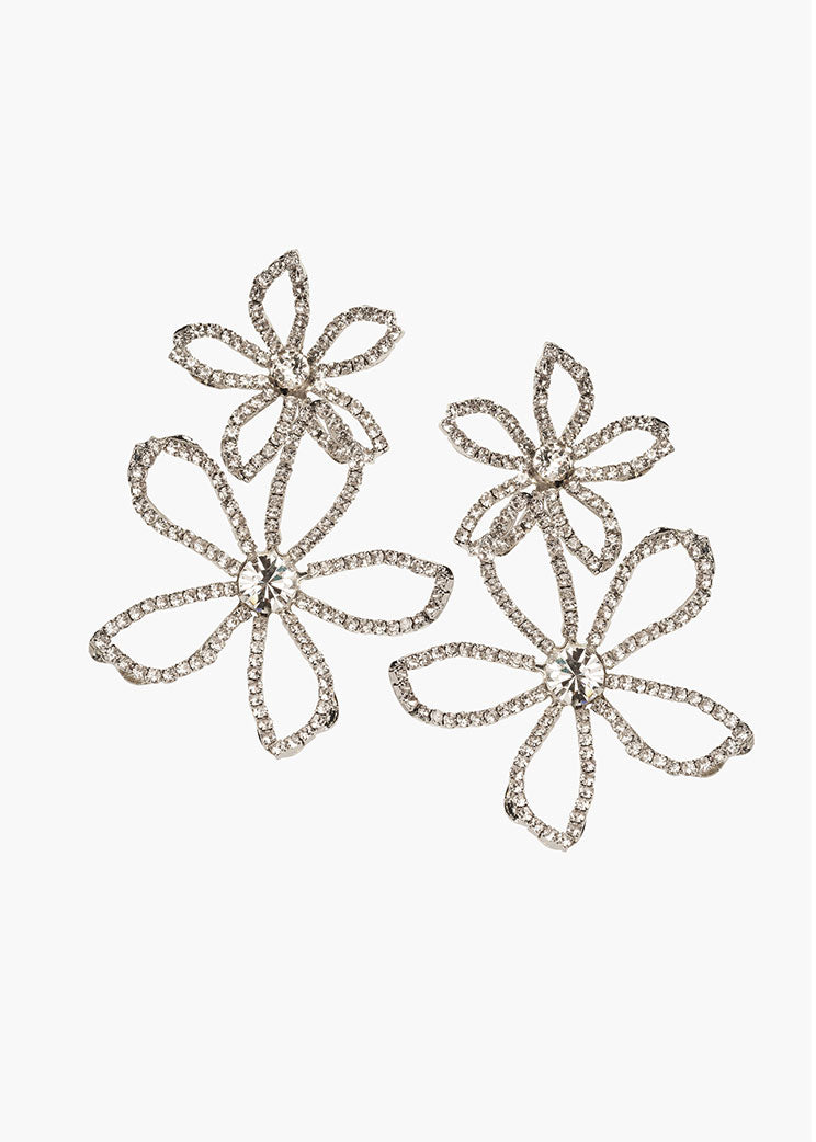 Pair of silver floral earrings on a white background