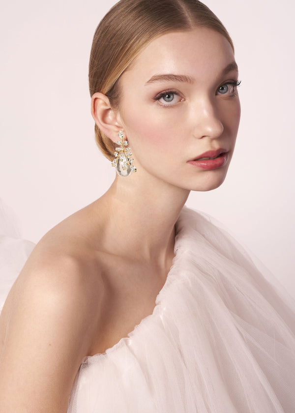 Glass tear drop crystal accents drop earring in gold on model 